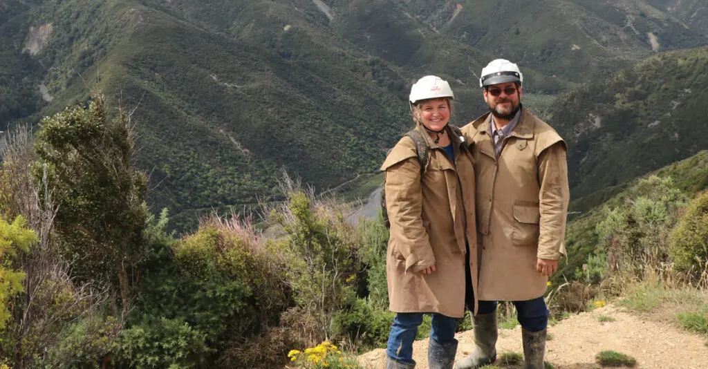 Julie and spouse hiking in mountains