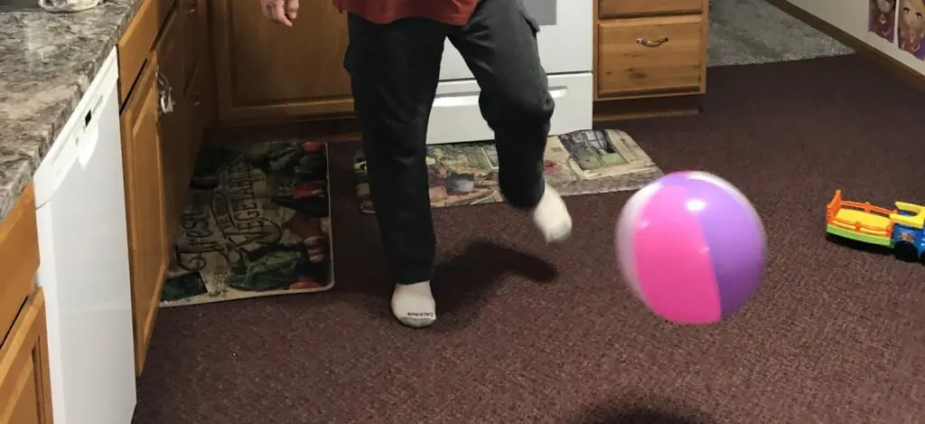 Larry kicking ball