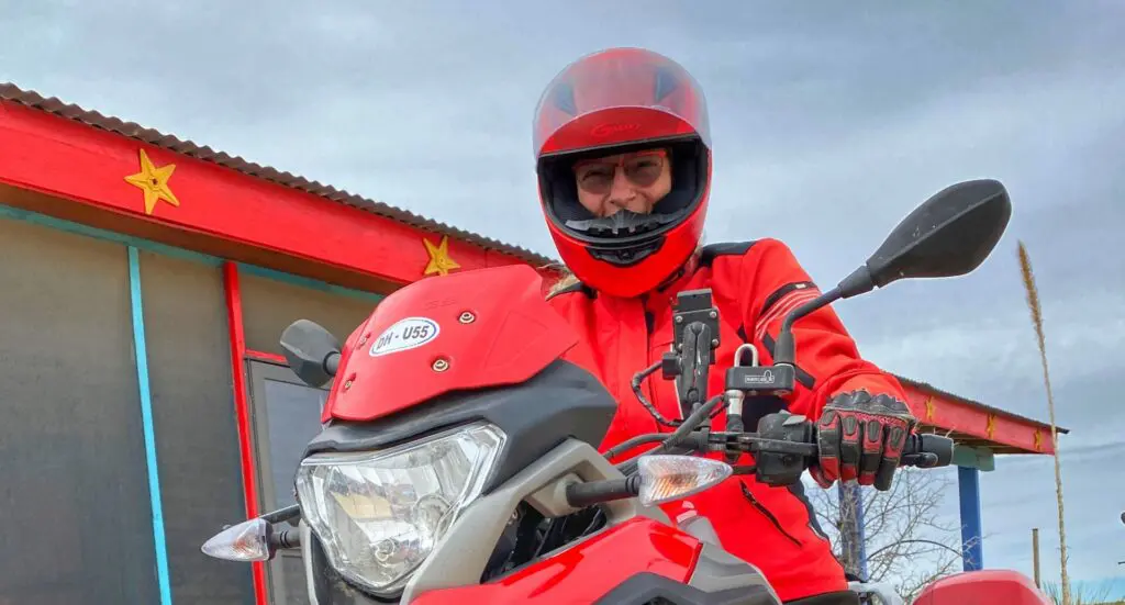 Yvonne riding red motorcycle