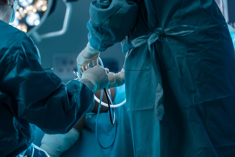 Orthopedic surgeon performing MACI procedure