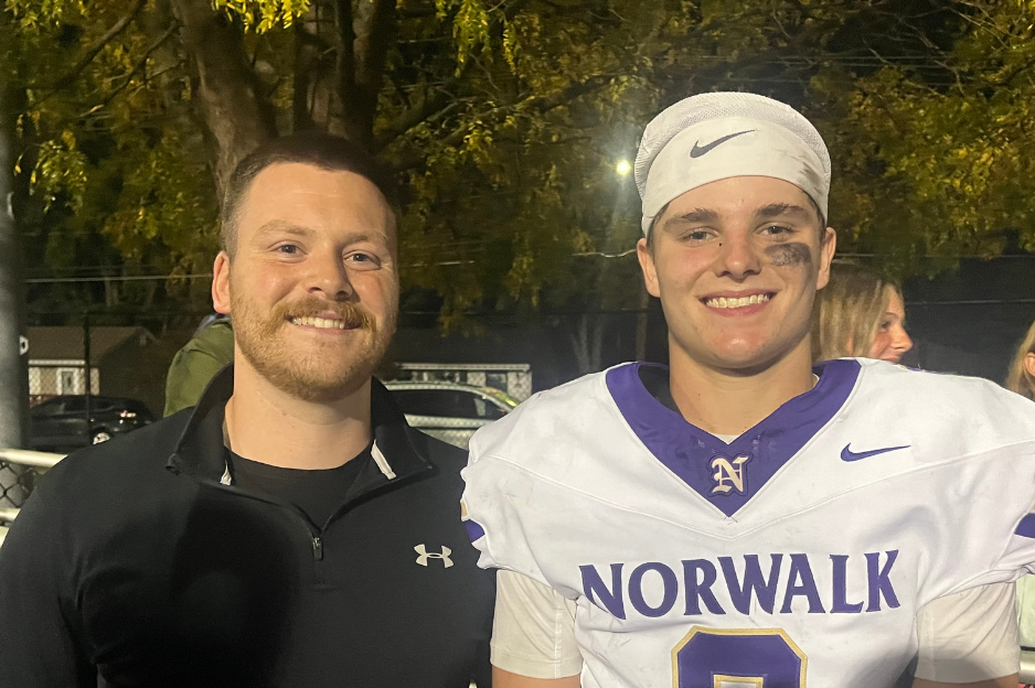 Luke and his physical therapist, Chase Morrison, at Luke's football game