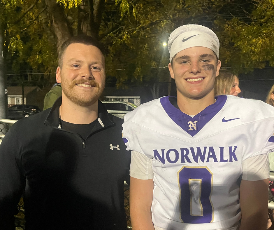 Luke and his physical therapist, Chase Morrison, at Luke's football game