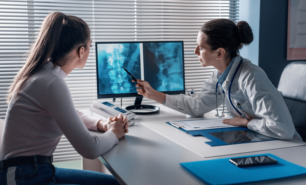 Patient discussing normal X-ray and ongoing joint pain with orthopedic provider